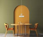 Interior design with wooden round table and chairs. Modern dining room with green and orange wall. Cafe, bar or restaurant interior design. Home interior. 3d rendering